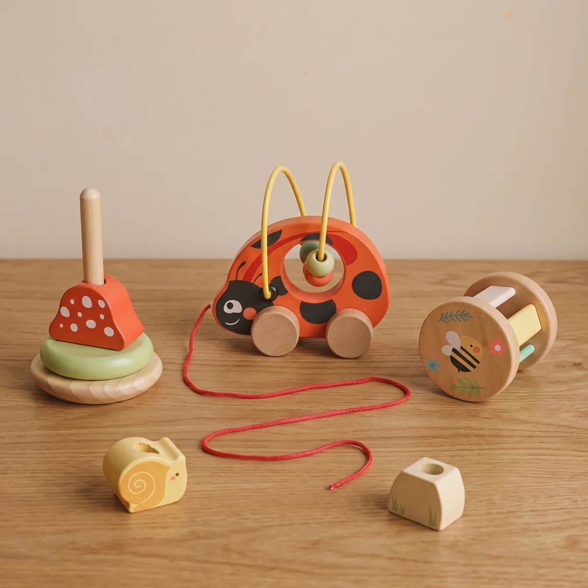 Koka mārītes 3-in-1 attīstošais komplekts, 8 detaļas, 12m+